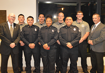 The Galveston College Law Enforcement Academy held its Class 9(D) graduation ceremony on Dec. 8, 2022 at the college’s Seibel Wing in Galveston. In photo, from left, Galveston College Law Enforcement Academy Program Director Bart Stephenson, graduates Jovani Herrera, Ernesto Ramos, Alex Garcia, Shamael Ruiz, Michael Yocum, Erik Mungia, Ethan Moffit and Law Enforcement Academy Instructor Larry Hawkins.