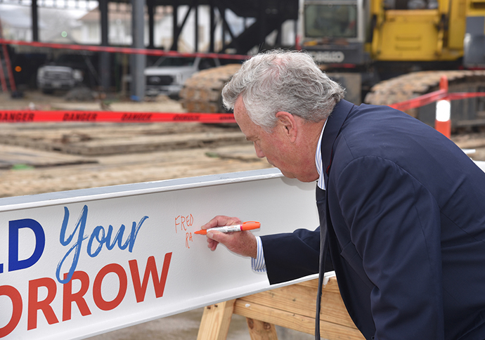 Board of Regent - Fred Raschke signing beam