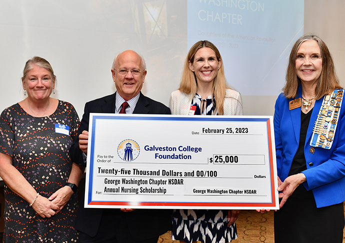 From left, Galveston College Nursing Program Director, Donna Carlin, GC President W. Myles Shelton, Ed.D., GC Director of Development and the Galveston College Foundation, Kelly Kennedy, and the George Washington Chapter NSDAR’s Galveston Regent, Shawn Bonath Carlson, hold the check presented to Galveston College on February 25, 2023 at the San Luis Resort.
