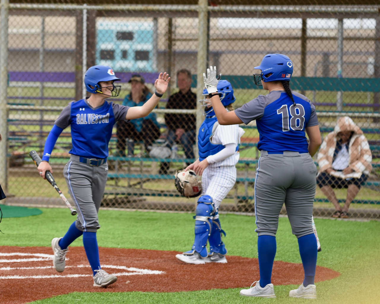 Galveston College players celebrate scoring against Monroe College on Feb. 15, 2023 at the Lassie League Complex in Galveston.